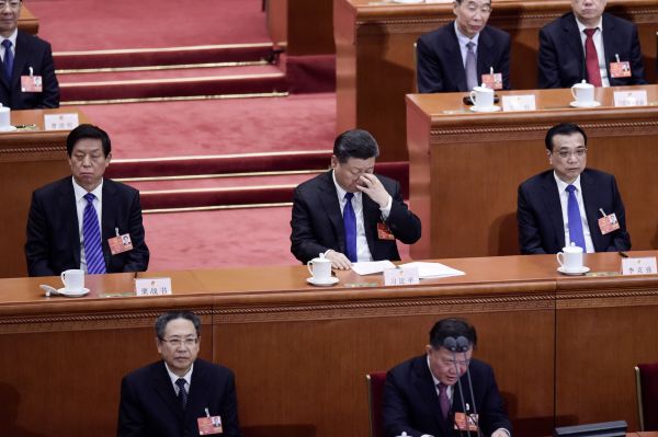 2018年3月19日，习近平、李克强、栗战书在参加第十三届全国人民代表大会。