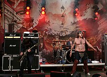 Turbonegro performing at Vikafestivalen, Mo i Rana, Norway on 22 July 2004. (L-R) Euroboy, Chris Summers, and Hank von Helvete