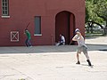 Image 16Stickball is a common street variant of baseball which often features impromptu adaptations. (Note the painted strike zone on the wall behind the batter.) (from Baseball)