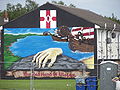 Mural de la Mano Roja, dedicado a la fundación mítica del Ulster, en un barrio lealista de Belfast.