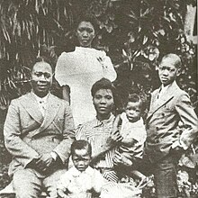 Reverend Israel and Chief Funmilayo seated, Dolu at back, Fela in the foreground and baby Beko, with Olikoye at right