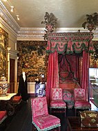 A four-poster bed, in the Tapestry room. The Mortlake tapestries that line this room belonged to King Charles I and were sold by Cromwell after the King’s execution.