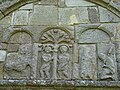 Arcade carvings: Adam and Eve and, at right, a warrior kneeling before a bishop