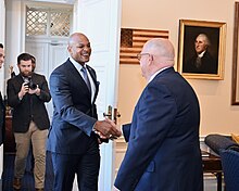 Larry Hogan shaking hands with Governor-elect Wes Moore