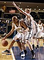 Image 6Navy Midshipmen George O’Garro rounds Army Cadet Steve Stoll in an attempt to score during the Army Navy basketball game in Alumni Hall at the U.S. Naval Academy, Annapolis, Maryland, January 31, 2004