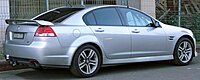 Rear-three-quarters view of a silver-coloured sedan