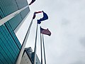 Waving American Flag in front of New World International Trade Tower, where Consulate-General of United States in Wuhan was located