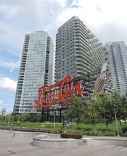 Building at 46-10 Center Boulevard as seen behind the Pepsi-Cola sign in 2015