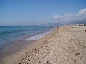 Yellow-colored sand in Castelldefels beach, Spain.