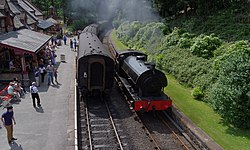 Hunslet Austerity "Repulse runs around its train at Haverthwaite in 2013.