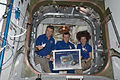 In honour of those affected by the 2011 Tōhoku earthquake and tsunami in Japan, Kondratyev (center), Nespoli & Coleman are pictured with origami cranes, which they folded to be placed in the HTV-2.