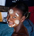 Image 19Malagasy girl in Nosy Be wearing masonjoany, an endemic decorative and protective paste made from ground wood (from Culture of Madagascar)