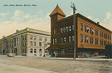 Three-story brick building with tower