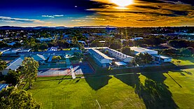 Aerial photo of the grounds of Aviation State High facing west (eastern courts at bottom of photo)