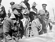 Kaida Tatsuichi, commander of the Japanese 4th Tank Regiment, and his chief of staff Shoji Minoru listen to the terms of surrender on HMAS Moresby at Timor.