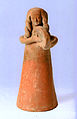 Mujer tocando, estatuilla de terracota de Shikmona, Israel. Museo Marítimo Nacional Israelí (s. VIII a. C.)