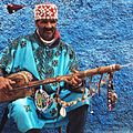 Image 38A Gnawa street performer wearing traditional Gnawi clothing in Rabat's Qasbat al-Widaya (from Culture of Morocco)