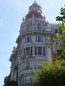 The corner of a building topped by a dome