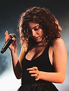 Lorde in a black dress