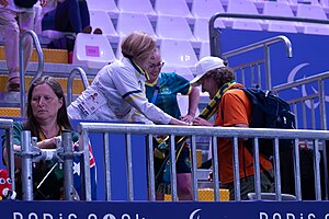 Paralympics Australia President Alison Creagh (left) and Australian Chef de Mission Kate McLoughlin (centre) present Hawkeye7 with a scarf