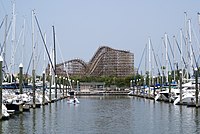 The boardwalk rollercoaster appears in the background with the lake and the marina in the foreground