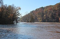 River flowing between forests with fall colors