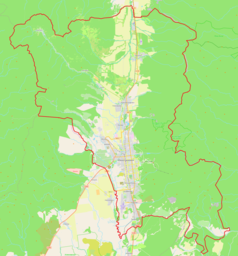 Mapa konturowa Jużnosachalińska, blisko centrum na dole znajduje się punkt z opisem „Jużnosachalińsk”