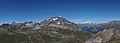 Mountain peak near the snow line and several mountain peaks above the snow line