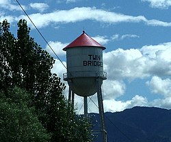 Welcoming water tower from a ranch road