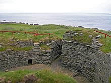 A photograph of the stone ruins of Burroughston Broch