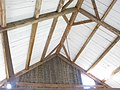 Common purlin framing with vertical boards in New England. This method of framing may be descended from board roofs but does not mean the roofing was originally just the boards.