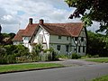 39 The Causeway is a late 14th-century timber-framed house, extended in the 15th and 17th centuries. It is Grade II* listed.[23] A cruck frame and an external bread oven are visible in the gable wall nearest the camera.