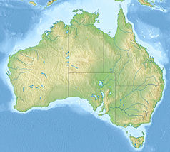 Mapa konturowa Australii, blisko prawej krawiędzi nieco na dole znajduje się czarny trójkącik z opisem „Mount Royal Range”