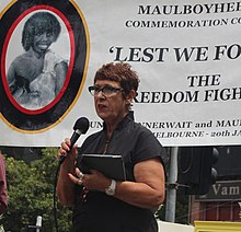 Carolyn Briggs conducting a Welcome to Country ceremony in 2018.