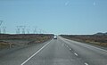 Travelling north on SH 1 through the Rangipo Desert. This section is known as the Desert Road, and is frequently closed by snow in winter.