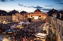 German rock band Revolverheld playing on a stage (center) in the palace courtyard, August 2016.