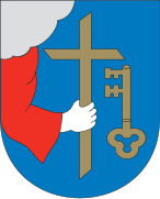 Hand holding Christian cross in the coat of arms of Pärnu