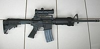 A Colt AR-15 Carbine with a Colt 4×20 scope.