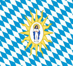 Virgin Mary, praying on a cloud, crowned with a glory; on a white oval; surrounded by a glory of yellow rays; on a field of white and blue lozenges, Bavarian style