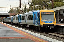 A modern train arriving at a platform.