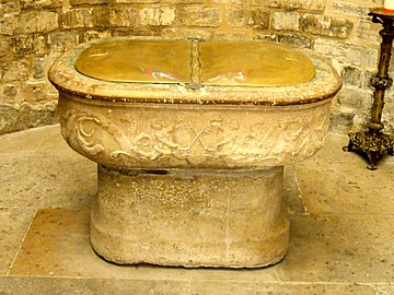 The baptismal font, in the form of the cradle of Moses (16th century)