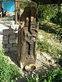 Pillar style khachkar with a Maltese Cross located behind a house in the village.