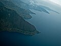 Aerial view of the southern shore with Sibandang Island visible in the background