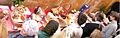 Orthodox Church of Rome priest (second from right) blesses paschal (Easter) foods including kulichs, eggs, and wine