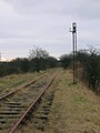 The line and old signal running towards Giffen station