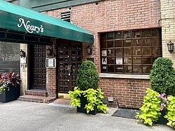 A brick building with a green awning reading "Neary's".