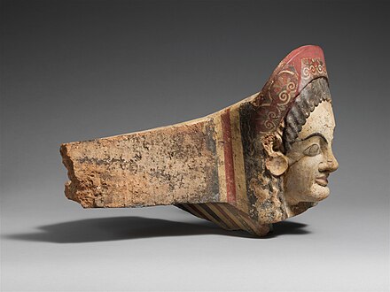 Etruscan antefix of a female figure with palmettes, c.520-510 BC, terracotta, Metropolitan Museum of Art[34]