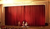 Main curtain used as a backdrop at a cinema.