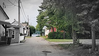 View of Tessier street in Sainte-Thècle (Quebec) from the intersection of Masson street in July 2021.