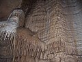 Image 14A flowstone formation inside Chimney Dome, part of Illinois Caverns in Monroe County. The cave is formed in limestone and dolomite by water dissolution and features stalactites, stalagmites, rimstone dams, flowstone, and soda straws. Photo credit: A. Frierdich (from Portal:Illinois/Selected picture)